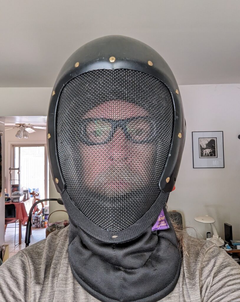 Me wearing my fencing mask over my new goggles