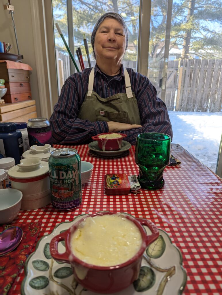 My bowl of French onion soup in the foreground, with Jackie and her bowl of soup in the background.